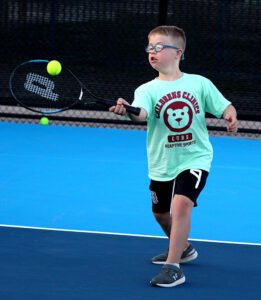 Boy playing tennis