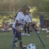 Boy playing soccer while using assistive devices for his legs